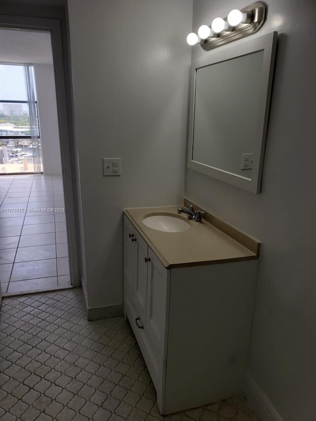 bathroom featuring tile floors and vanity