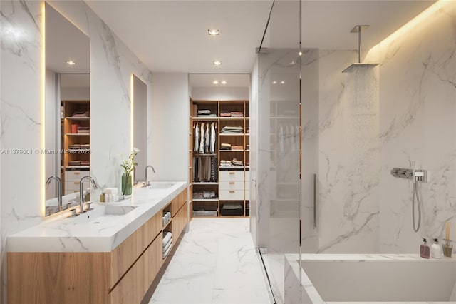 bathroom with tiled shower and vanity