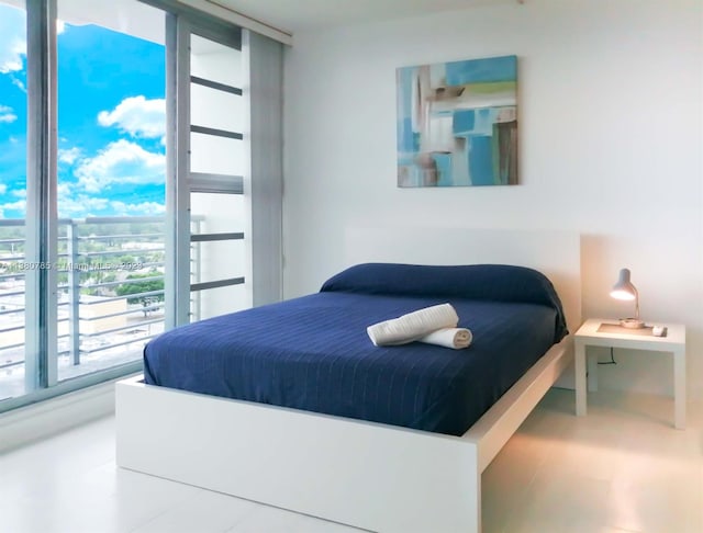 bedroom featuring a wall of windows