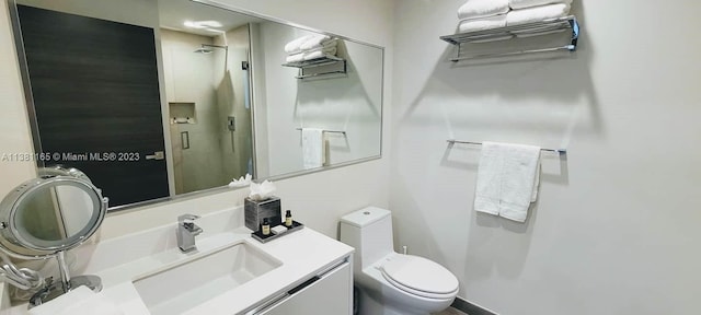 bathroom with toilet and vanity