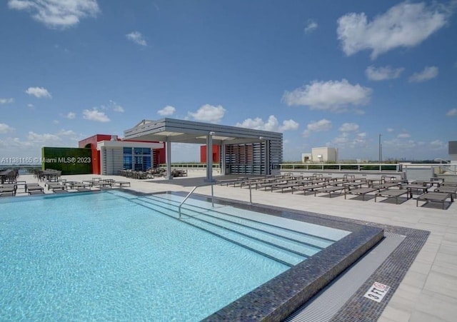 view of swimming pool featuring a patio area