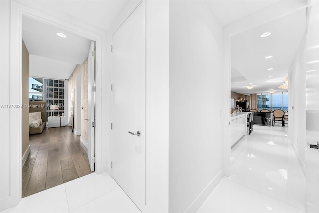 corridor featuring light hardwood / wood-style floors