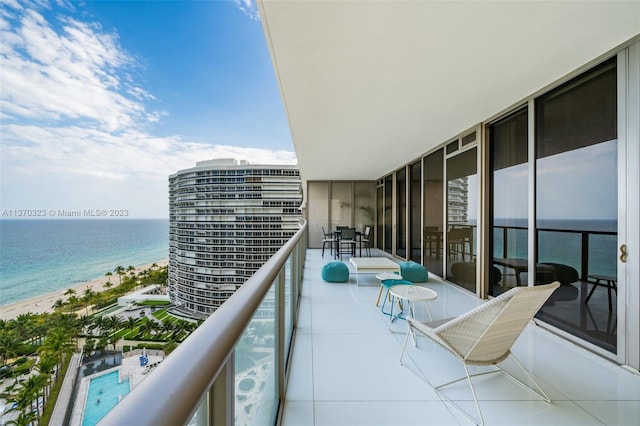 balcony featuring a water view