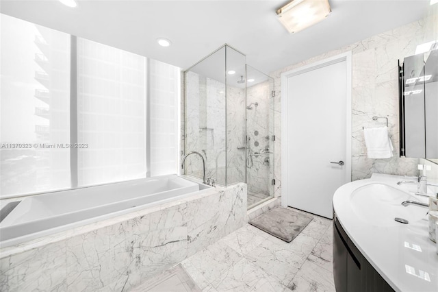 bathroom with tile walls, tile floors, vanity, and independent shower and bath