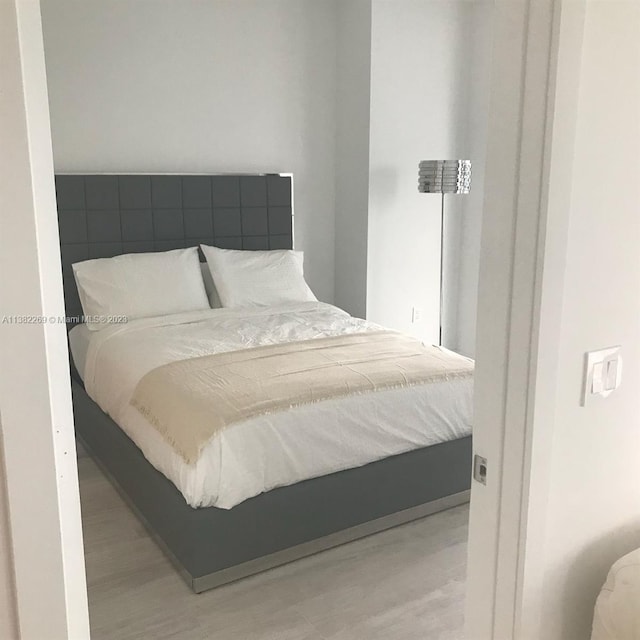 bedroom with light wood-type flooring