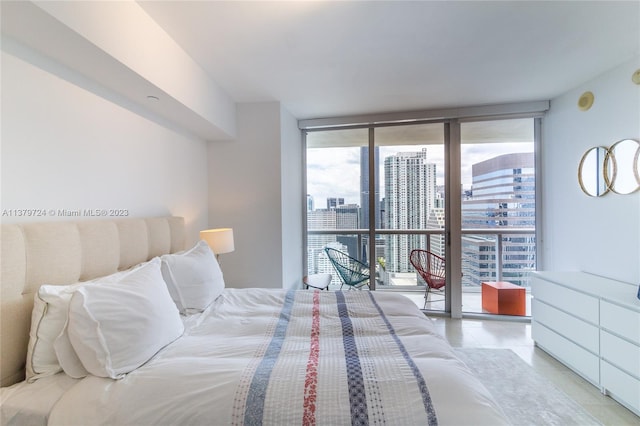 bedroom with floor to ceiling windows and light tile floors