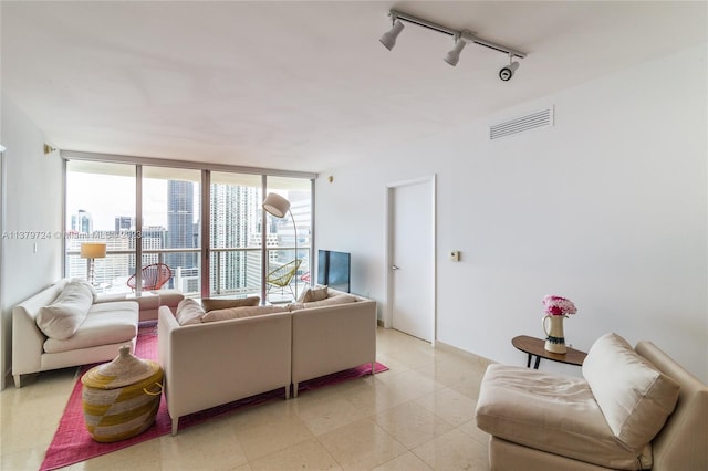 living room featuring light tile floors and track lighting