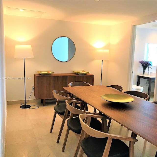 dining room with light tile flooring