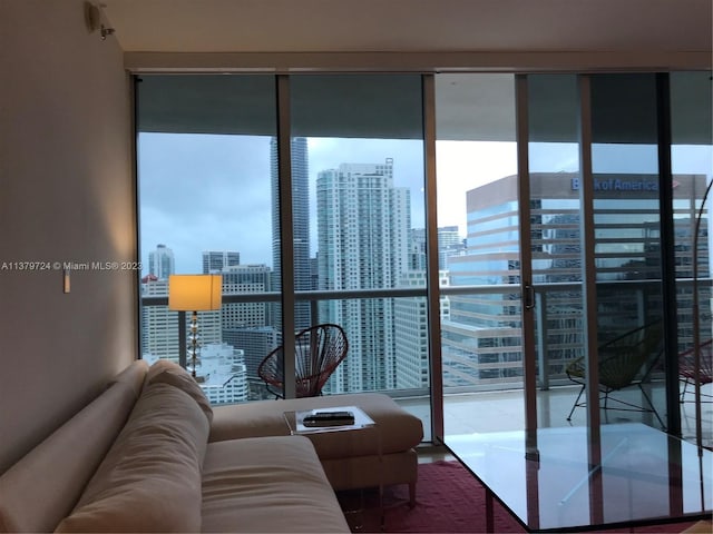 living room featuring floor to ceiling windows