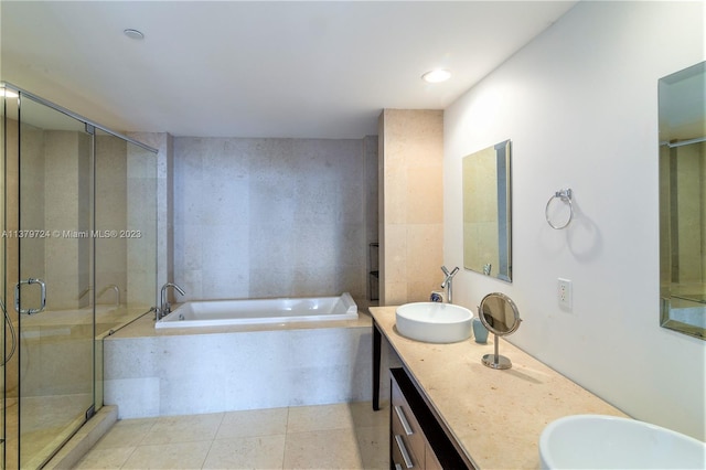 bathroom featuring shower with separate bathtub, tile floors, and double vanity