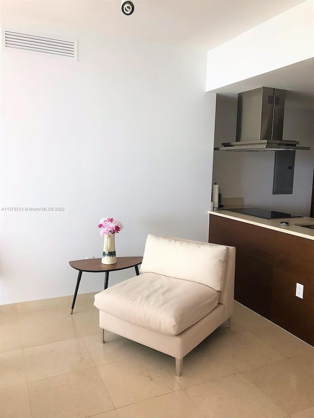 living area featuring light tile flooring