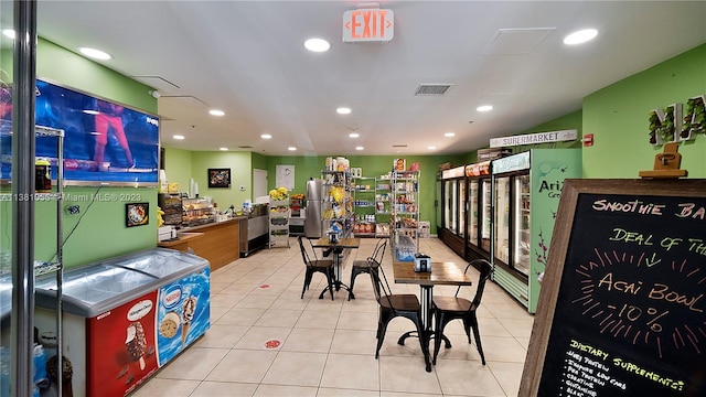 interior space featuring light tile floors