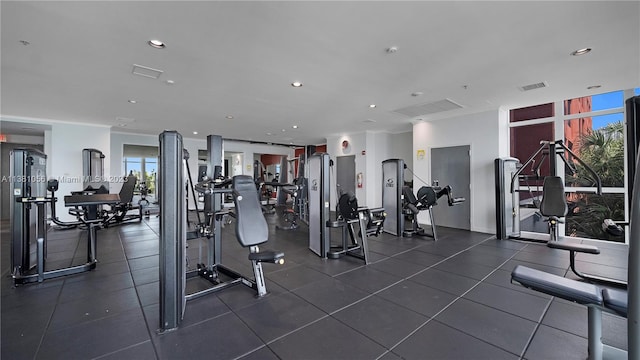 workout area with dark tile floors