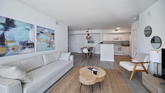 living room with hardwood / wood-style flooring