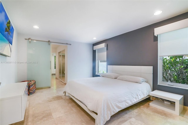 bedroom featuring a barn door