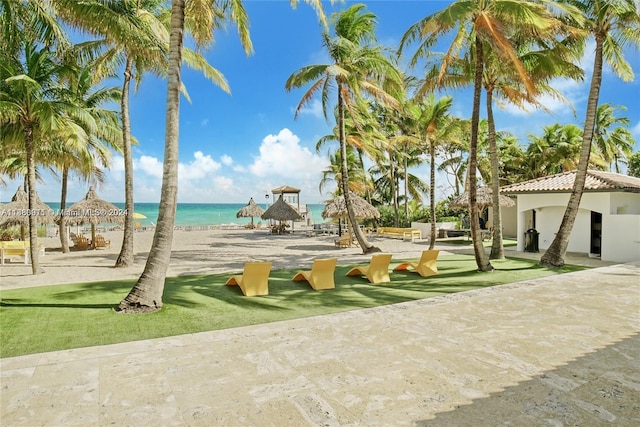 view of community featuring a yard and a water view