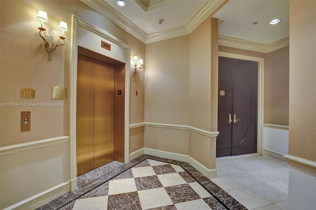 tiled entryway featuring elevator and crown molding