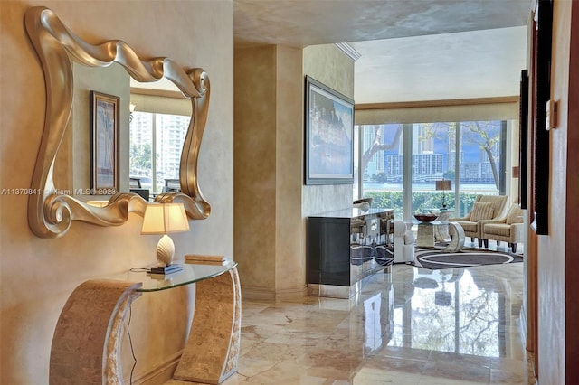 bathroom featuring plenty of natural light and crown molding