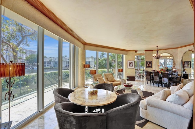 living room featuring a chandelier, light tile flooring, and crown molding