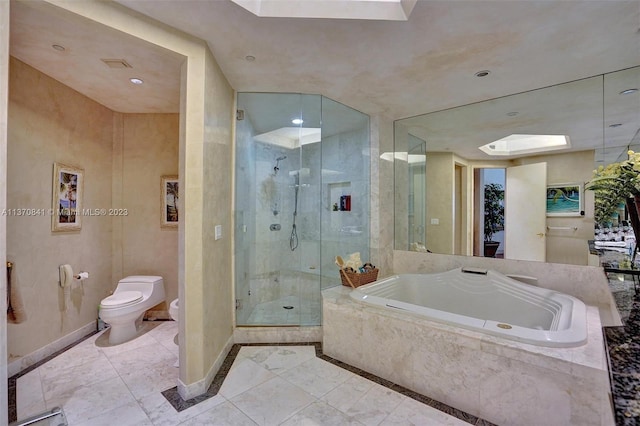 bathroom with shower with separate bathtub, toilet, a skylight, and tile flooring