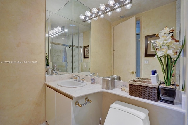 bathroom featuring toilet and oversized vanity