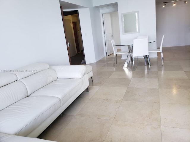 tiled living room with rail lighting