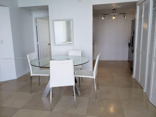 tiled dining space with track lighting