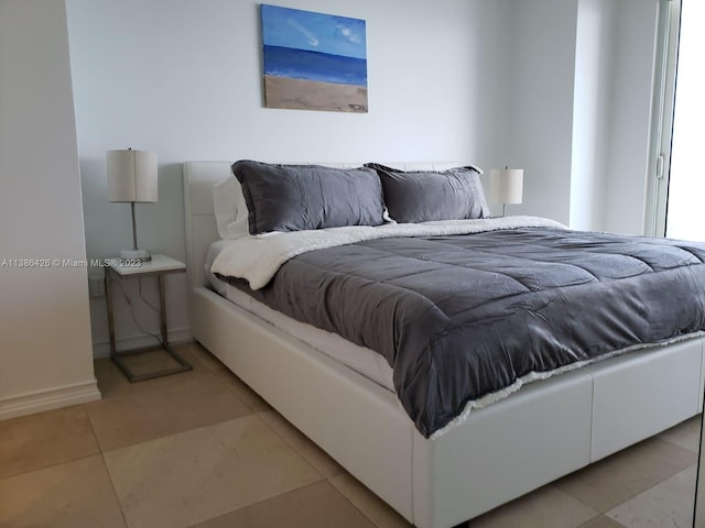 bedroom featuring light tile flooring