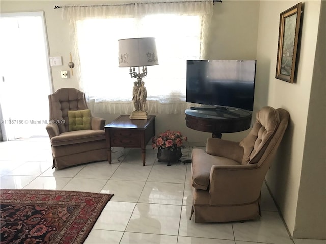 tiled living room with plenty of natural light