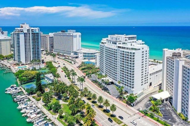 drone / aerial view featuring a water view and a city view