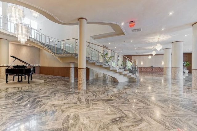 community lobby featuring stairway and visible vents