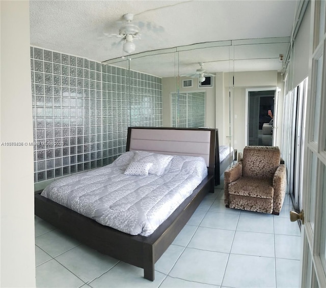 bedroom with light tile patterned floors and visible vents