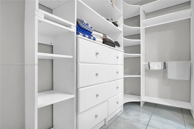 walk in closet featuring light tile patterned floors