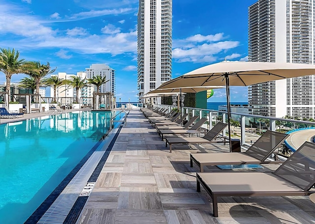 view of swimming pool with a water view