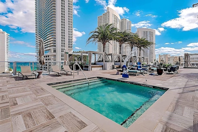 view of swimming pool featuring a patio area