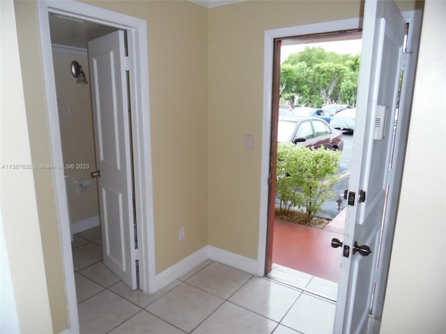 corridor featuring light tile floors