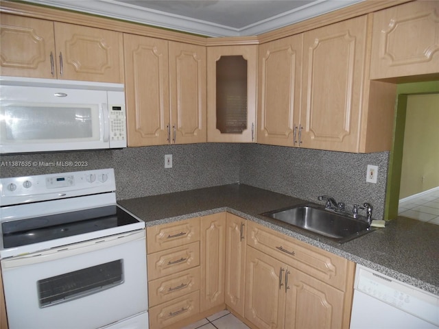 kitchen featuring sink, tasteful backsplash, white appliances, and light brown cabinetry