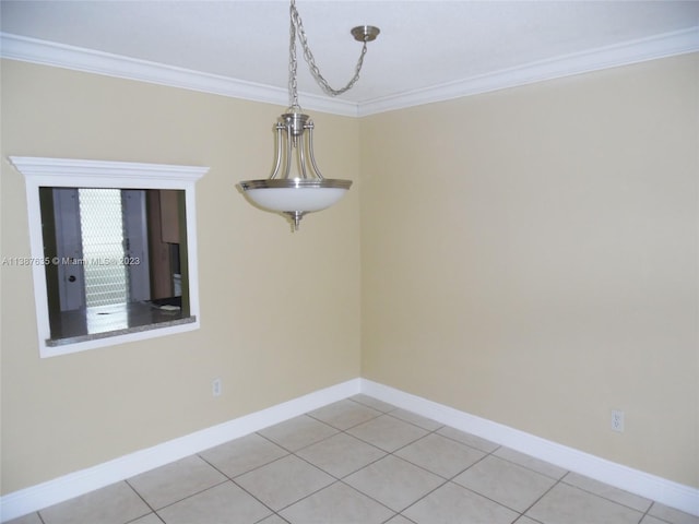 unfurnished room with crown molding and tile flooring