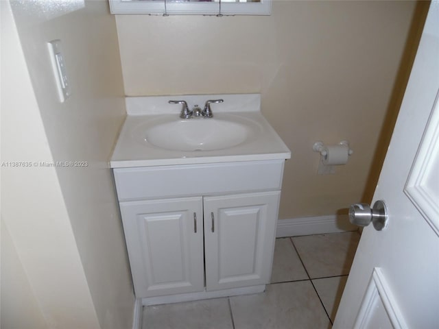 bathroom with vanity and tile floors