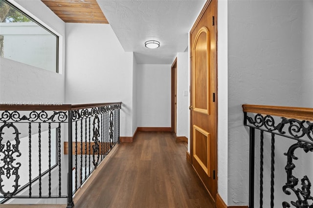 hallway with wooden ceiling and dark wood-type flooring