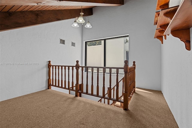 interior space with high vaulted ceiling, a chandelier, carpet floors, and beamed ceiling