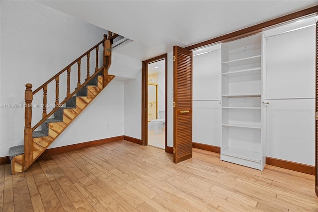 unfurnished living room featuring light hardwood / wood-style flooring