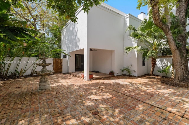 rear view of property featuring a patio