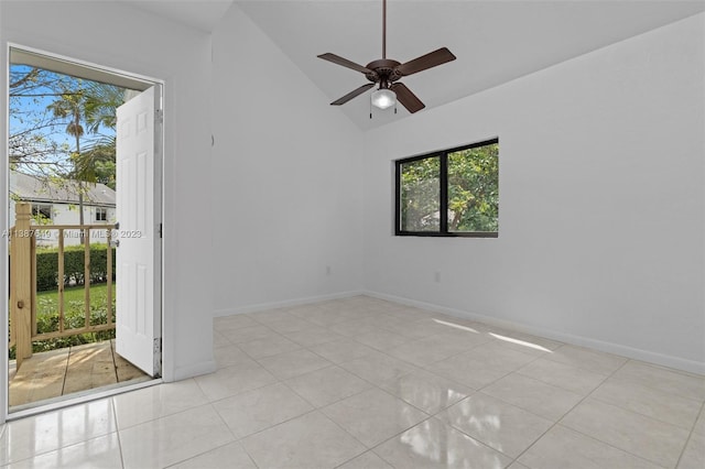 unfurnished room featuring vaulted ceiling, ceiling fan, light tile floors, and a wealth of natural light