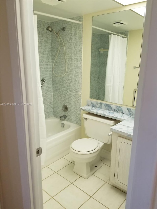 full bathroom with vanity, tile floors, toilet, and shower / bathtub combination with curtain