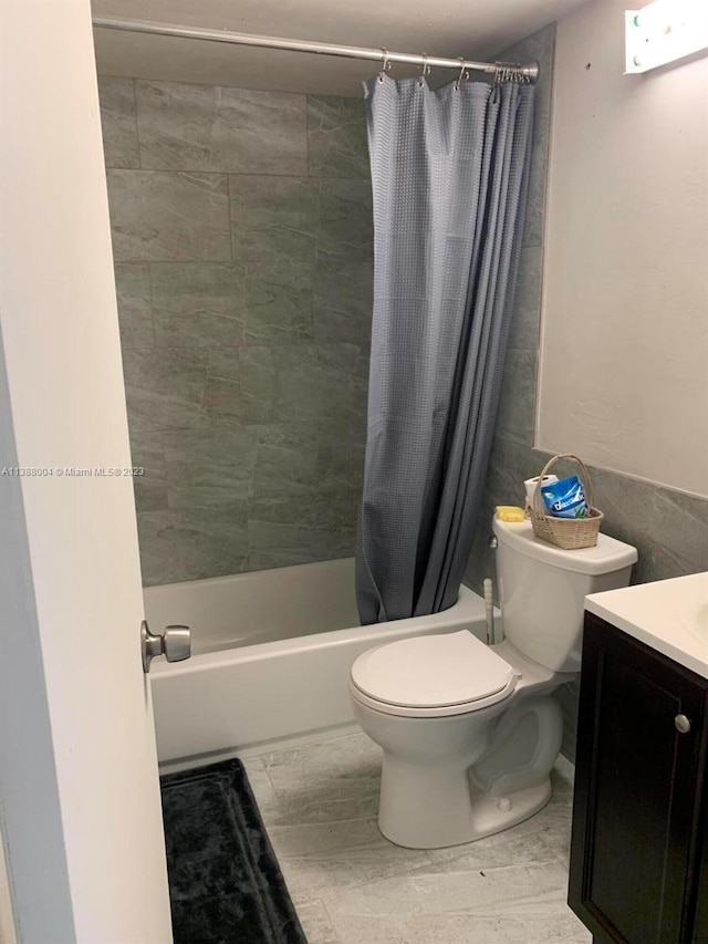 full bathroom with toilet, shower / bathtub combination with curtain, and vanity