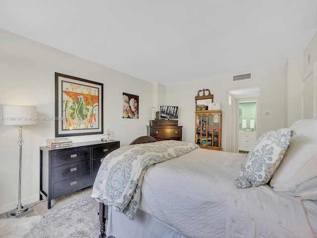 bedroom with light hardwood / wood-style floors