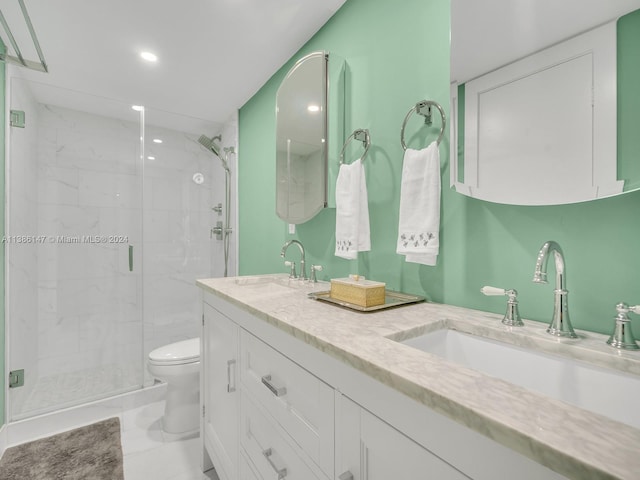 bathroom featuring tile patterned flooring, an enclosed shower, vanity, and toilet