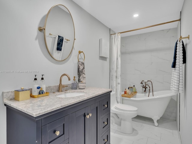 bathroom with a bath, vanity, and toilet