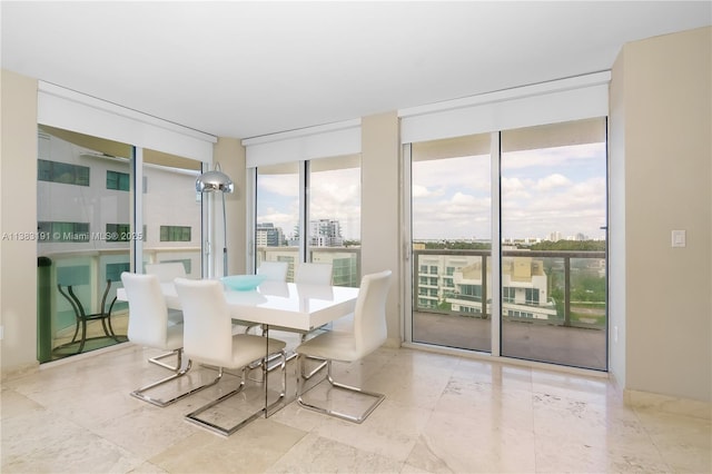6365 Collins Ave Unit 907, Miami Beach, FL 33141 - dining room featuring a wall of windows